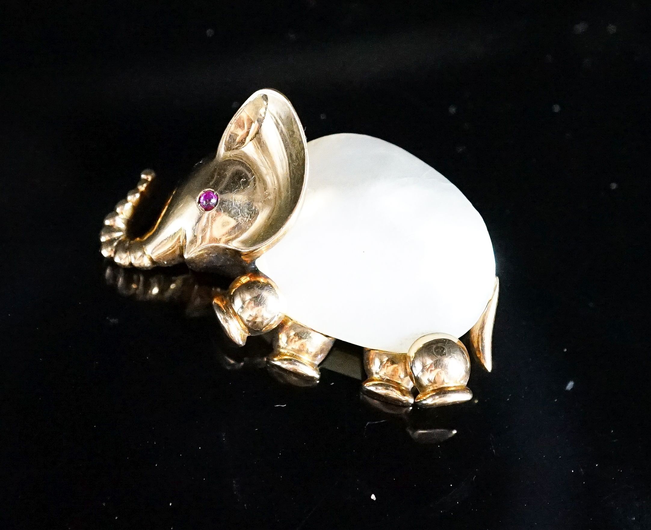 A 20th century Viennese 585 yellow metal, mother of pearl and ruby chip set brooch, modelled as an elephant, 35mm, gross weight 12.7 grams.